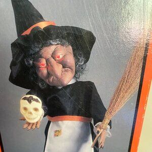 Vintage Witch, eyes lit, lighted skull